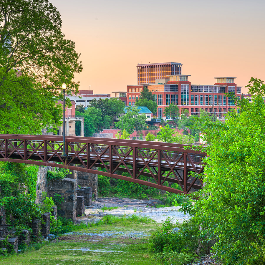 Columbus, Georgia, USA downtown skyline and park at dawn.