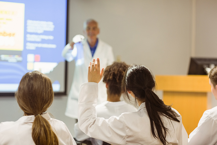 Medical education teacher calling on a student